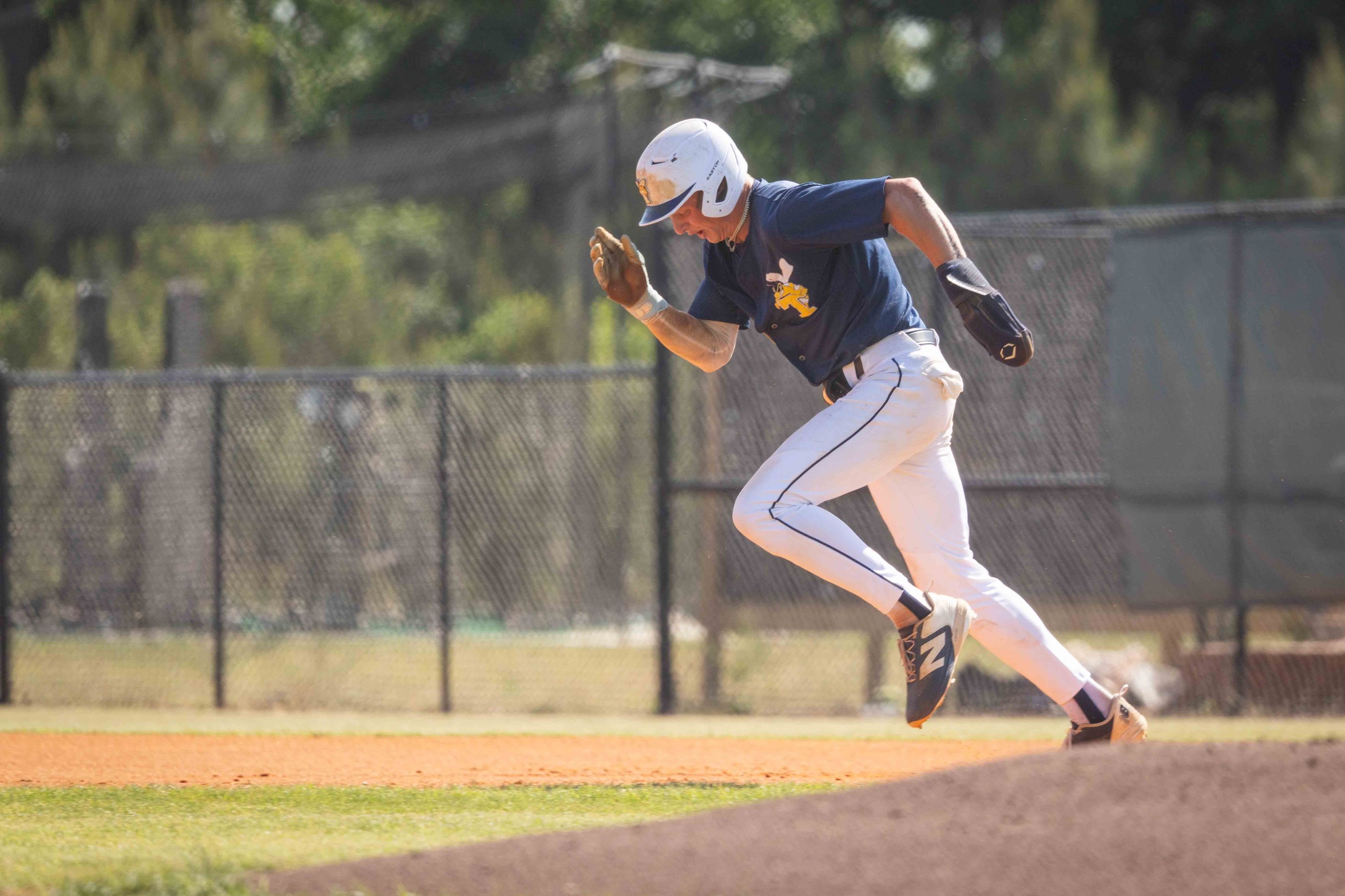 Jackson Cook runs toward second from first base.