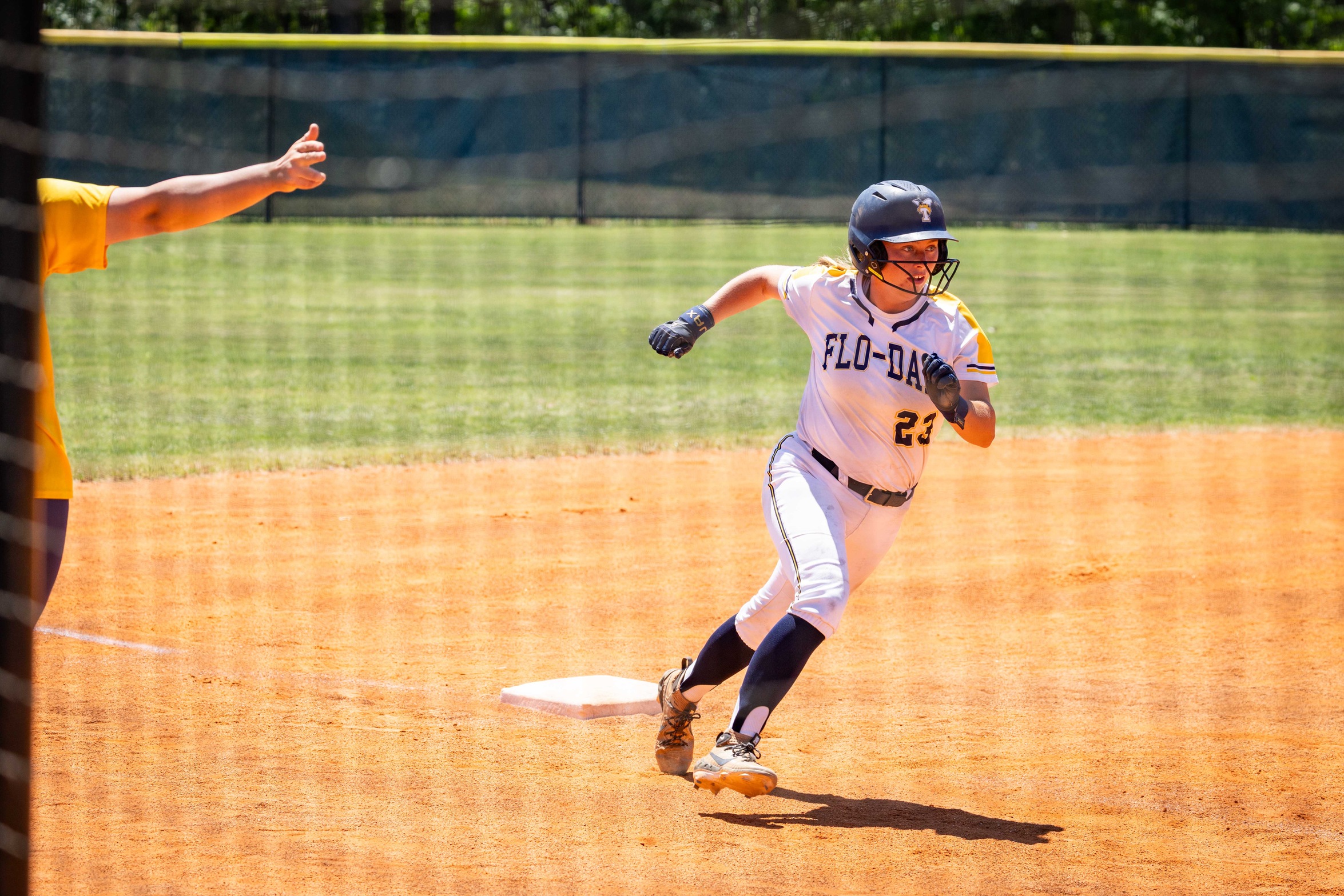 Hayleigh Atkinson #23 running from 3rd to home base for a score.